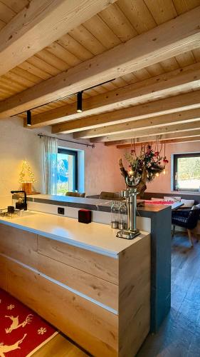 a kitchen with a center island in a house at Lo Chalet Incantato del Maso K in Folgaria
