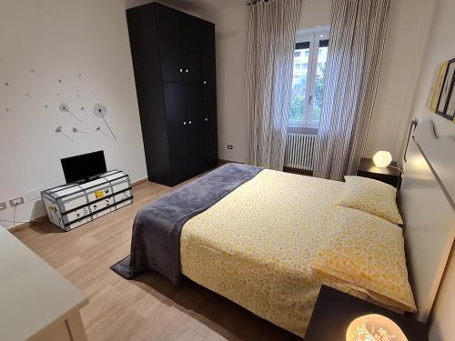 a bedroom with a bed and a television in it at aria di mare in Sestri Levante