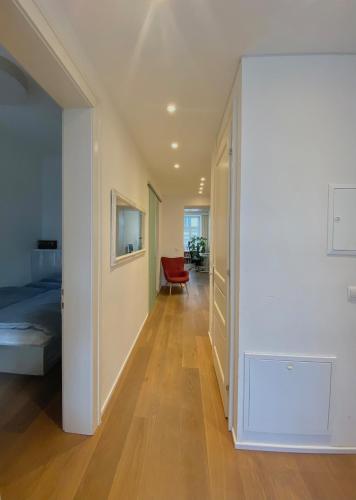 a hallway with a room with a bed and a door at Urban Hotspot Apartment in Vienna