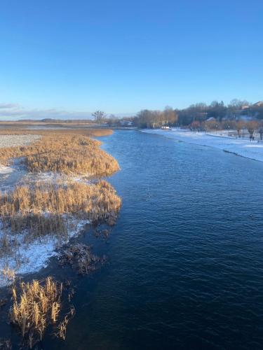 an aerial view of a river with grass at Biebrzańska Przystań 3 in Goniadz