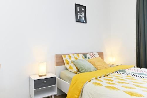 Katil atau katil-katil dalam bilik di TC Residences - Charmant Appartement