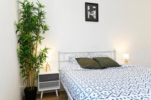 Katil atau katil-katil dalam bilik di TC Residences - Charmant Appartement