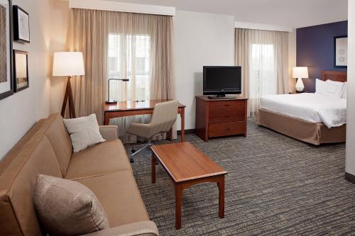 a hotel room with a couch and a bed and a tv at Residence Inn by Marriott Tucson Williams Centre in Tucson