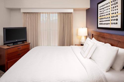 a hotel room with a bed and a television at Residence Inn by Marriott Tucson Williams Centre in Tucson