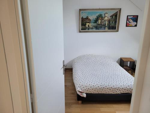 Postel nebo postele na pokoji v ubytování Maison chaleureuse dans un ancien corps de ferme