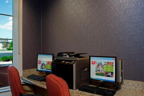 an office with two computer monitors and a printer at Residence Inn Toledo Maumee in Maumee