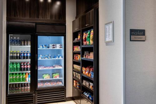 a store with two refrigerators with drinks and food at Residence Inn by Marriott Winnipeg in Winnipeg