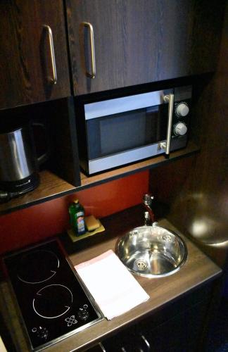 Η κουζίνα ή μικρή κουζίνα στο Stay2Munich Hotel & Serviced Apartments