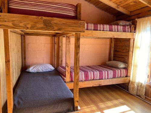 Ένα ή περισσότερα κρεβάτια σε δωμάτιο στο Hostel Casa Sur