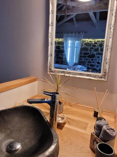 a bathroom with a bath tub and a mirror at Aelia Apartments Limnos in Thános