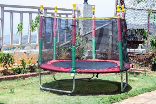 a merry go round on a playground at TAJ VILLA Mahabaleshwar ! in Mahabaleshwar
