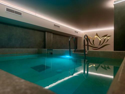 a bathroom with a large swimming pool with at St. Panteleimon Beach Hotel in Nesebar