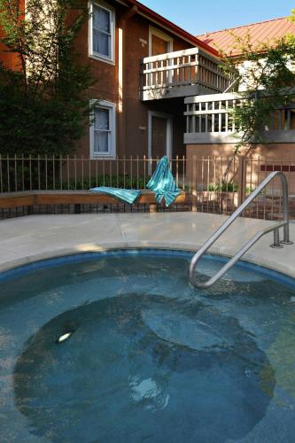 a pool of water with a slide in front of a building at Residence Inn Santa Fe in Santa Fe