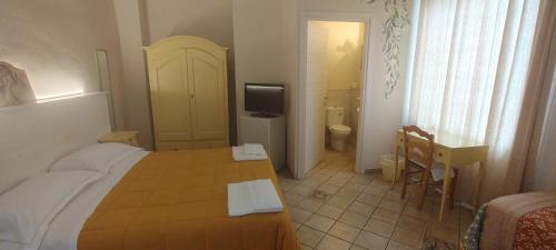 Ένα ή περισσότερα κρεβάτια σε δωμάτιο στο B&B San Martino