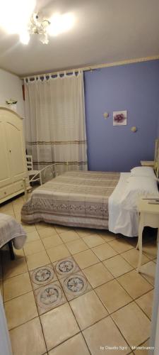 Ένα ή περισσότερα κρεβάτια σε δωμάτιο στο B&B San Martino
