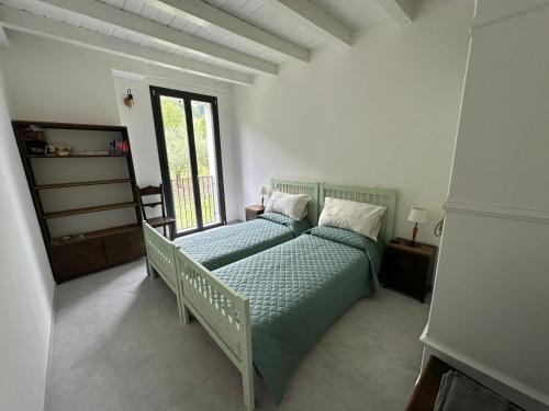 Ένα ή περισσότερα κρεβάτια σε δωμάτιο στο B&B Marco Zona Autodromo IMOLA