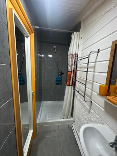 a bathroom with a shower and a sink at Gwada Rêves in Sainte-Anne