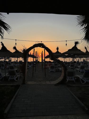 a group of chairs and umbrellas at the beach at Comfort Suites in Golem