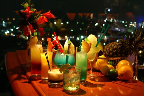 a table with some drinks and fruit on it at Okinawa Grand Mer Resort in Okinawa City