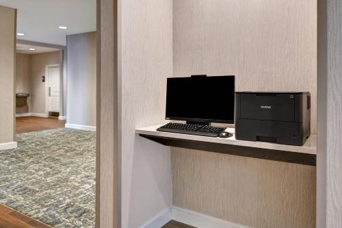 a computer sitting on a counter in a hotel room at Residence Inn by Marriott Fort Walton Beach in Fort Walton Beach