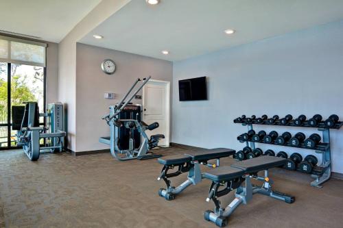 a fitness room with a gym with bikes and weights at Residence Inn by Marriott Fort Walton Beach in Fort Walton Beach