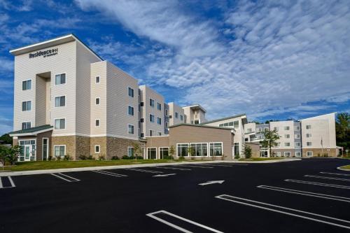 an empty parking lot in front of a hospital at Residence Inn Middletown Goshen in Middletown