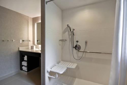 a bathroom with a shower and a sink at Residence Inn Middletown Goshen in Middletown
