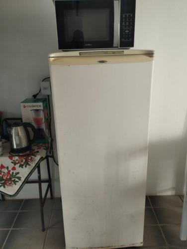 Kuchyň nebo kuchyňský kout v ubytování Apartamento Duplex na praia de Salinas RS