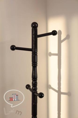a black metal pole with three shelves on a door at The Central Pattaya High Floor, Pattaya City in Pattaya Central
