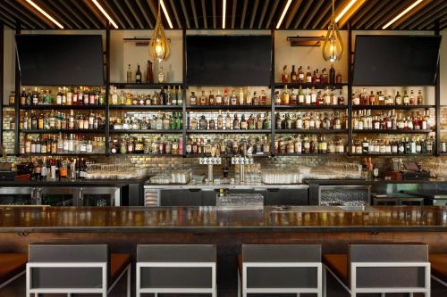 a bar with a lot of liquor bottles at Residence Inn by Marriott San Jose Cupertino in Cupertino