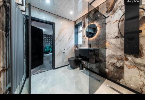a bathroom with a sink and a mirror at MyNites in Birmingham