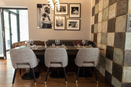 a dining room with a table and four chairs at Residence Inn by Marriott Toulouse-Blagnac in Blagnac