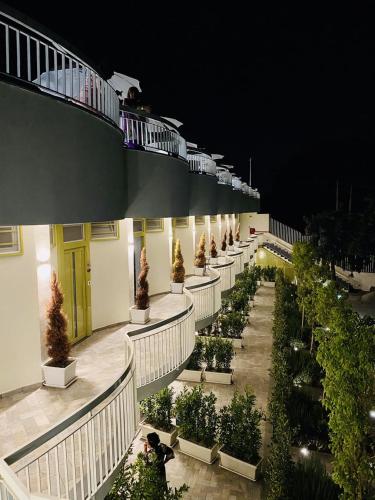 a building with a row of plants on the side at Vesuvio Inn Bed & Wine Experience in Boscotrecase