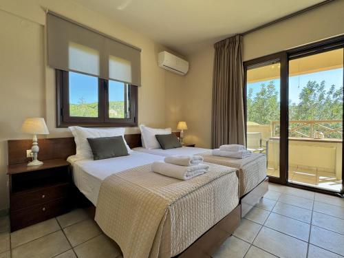 Postel nebo postele na pokoji v ubytování Villa Metapothia Gavalochori Crete