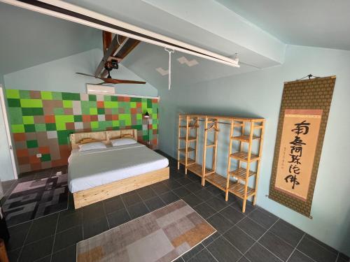 a room with a bed and a shelf in it at WHITE SAND ARK RESORT in Koh Rong Island