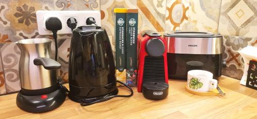 a group of appliances sitting on top of a counter at Morava 1 Asparuhovo Beach Holiday House in Varna City