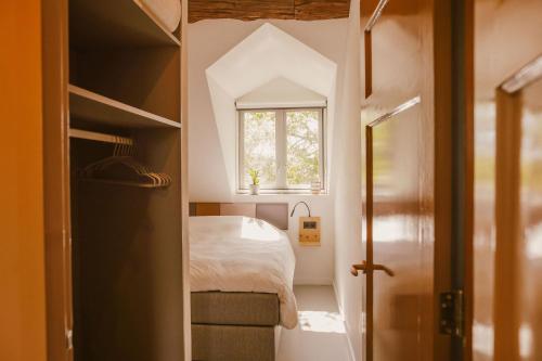 Ένα ή περισσότερα κρεβάτια σε δωμάτιο στο Boutiquehotel & Tiny houses PLEK17