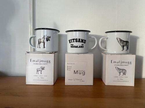 a group of four coffee mugs sitting on a table at Tim's Place in Gunsjögården