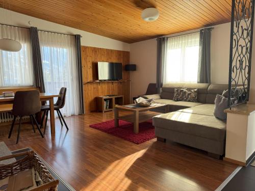 a living room with a couch and a table at Haus Angelika in Vandans