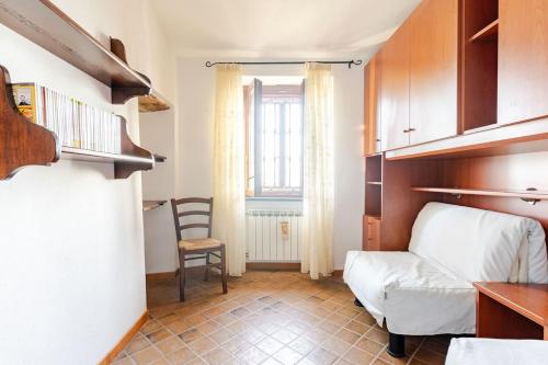 a living room with a couch and a chair at Sea-View Retreat - Pool, Tavern, Fireplace in Rapallo