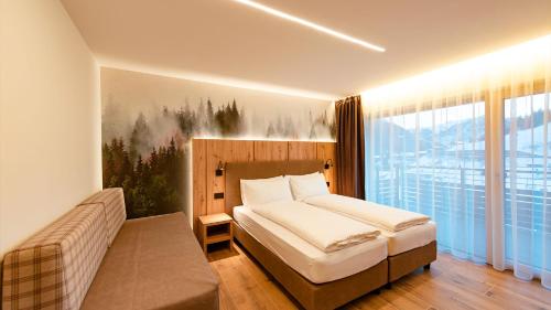 Postel nebo postele na pokoji v ubytování Dolomites Room and Breakfast Formiè