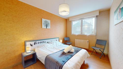 Ένα ή περισσότερα κρεβάτια σε δωμάτιο στο Balcon de la plage