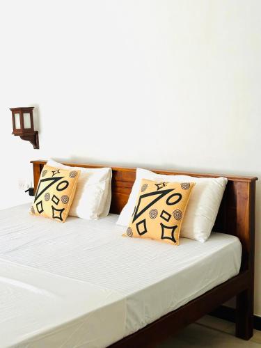 Ένα ή περισσότερα κρεβάτια σε δωμάτιο στο Welcome Family Guest House.