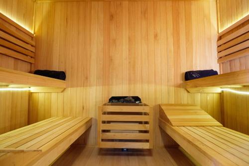 a sauna with wooden shelves and benches in it at Hotel Boutique Finca La Niebla in Coatepec