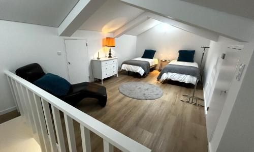 En eller flere senge i et værelse på Casa do Lado - Vila Franca do Campo - AL