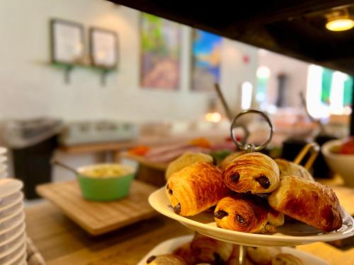 a plate of pastries sitting on top of a table at Hotel Skovly in Rønne