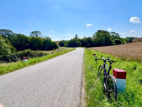 a bike parked on the side of a road at Hotel Skovly in Rønne