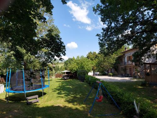 a yard with a swing set and a playground at Casa Campomonte in Poppi