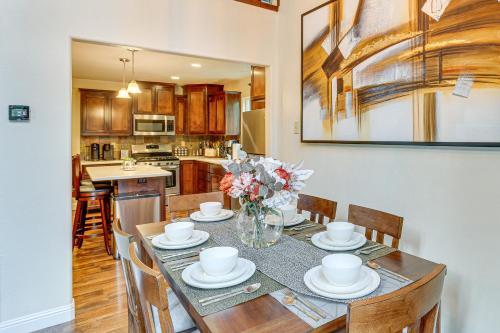 a kitchen and dining room with a table and chairs at Private Cabin with Forest Views and Grill in Lakehead! in Lakehead