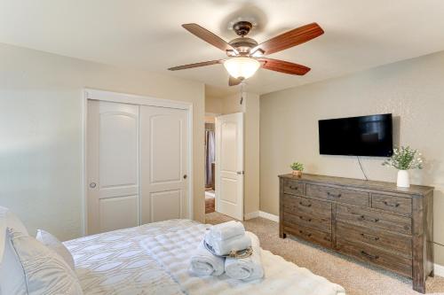 a bedroom with a bed and a ceiling fan at Private Cabin with Forest Views and Grill in Lakehead! in Lakehead